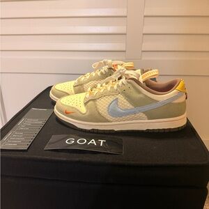 Nike Cream and Blue Athletic Shoes with Orange Accents